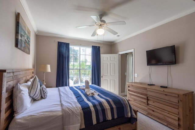 carpeted bedroom featuring ceiling fan and crown molding