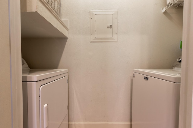 laundry area with separate washer and dryer and electric panel