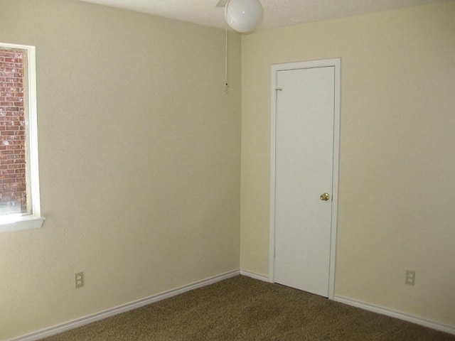 unfurnished room featuring carpet