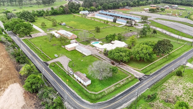 birds eye view of property with a rural view