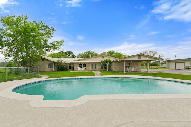 view of pool featuring a fenced in pool, a lawn, a patio, and fence