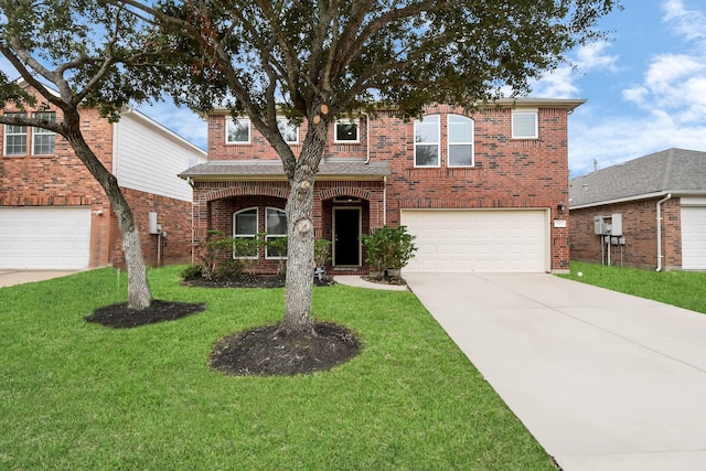 view of front of home featuring a front yard and a garage