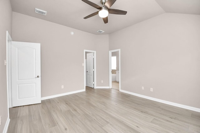 interior space featuring ceiling fan, light wood-type flooring, and vaulted ceiling