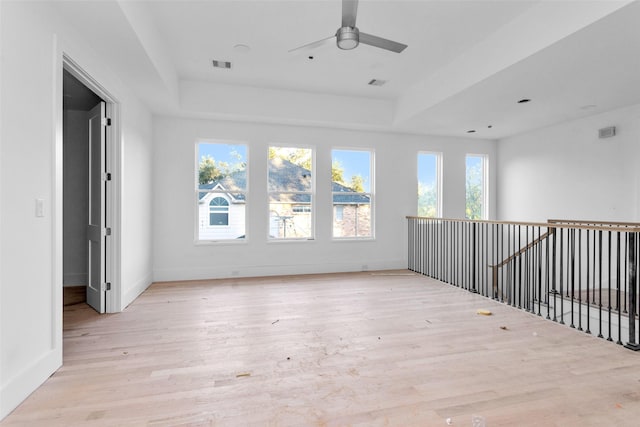 spare room with ceiling fan and light hardwood / wood-style floors