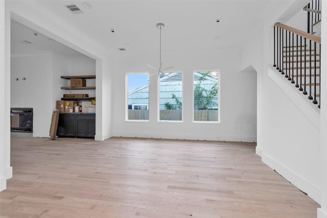 unfurnished living room featuring light hardwood / wood-style flooring