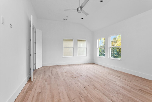 spare room featuring ceiling fan, light hardwood / wood-style floors, and lofted ceiling