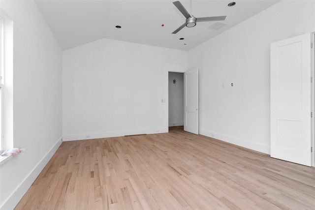 interior space with ceiling fan, lofted ceiling, and light wood-type flooring