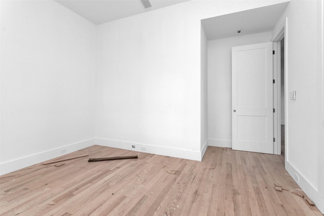 unfurnished room with light hardwood / wood-style flooring