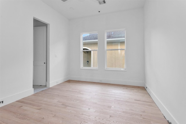 empty room with light hardwood / wood-style floors