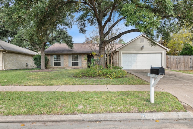 ranch-style house featuring a front yard and a garage