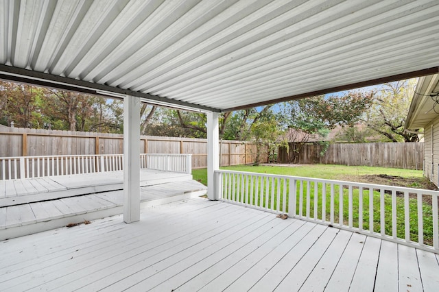 wooden terrace featuring a yard