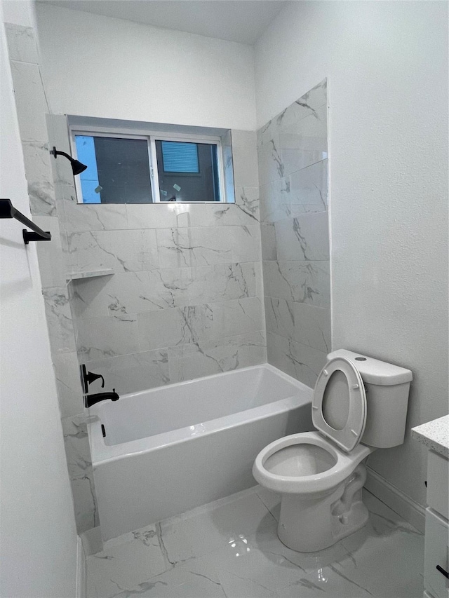 full bathroom featuring vanity, toilet, and tiled shower / bath combo