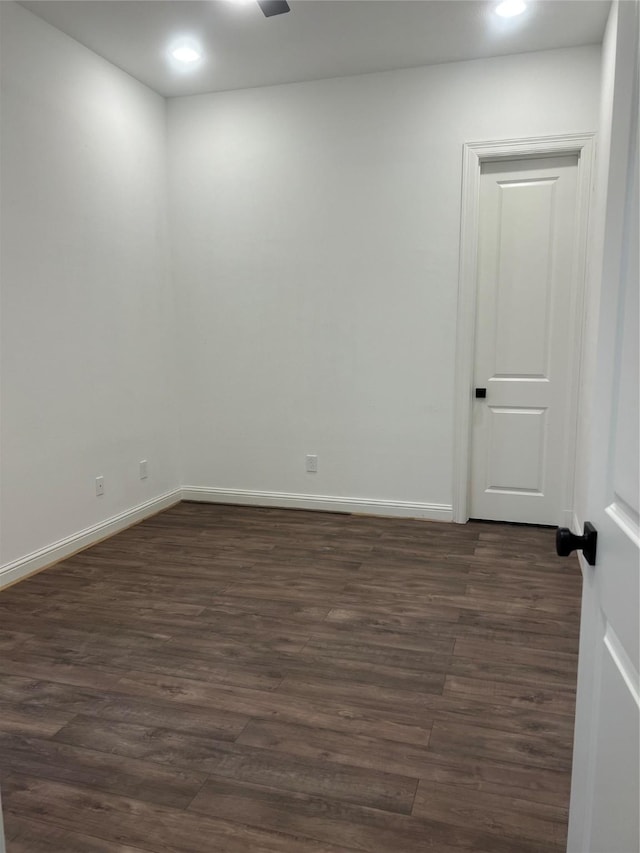 unfurnished room featuring dark hardwood / wood-style flooring