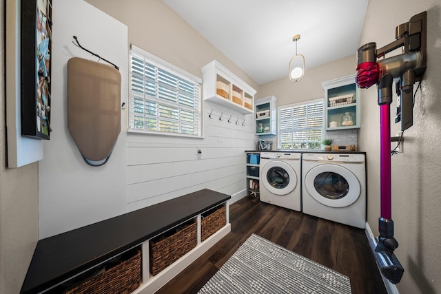 laundry room featuring washer and dryer and dark wood-type flooring