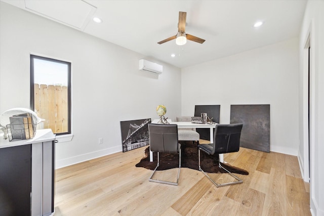 dining space featuring a wall mounted AC, light wood-type flooring, and recessed lighting