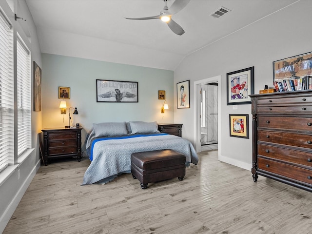 bedroom featuring ceiling fan, light hardwood / wood-style floors, and lofted ceiling