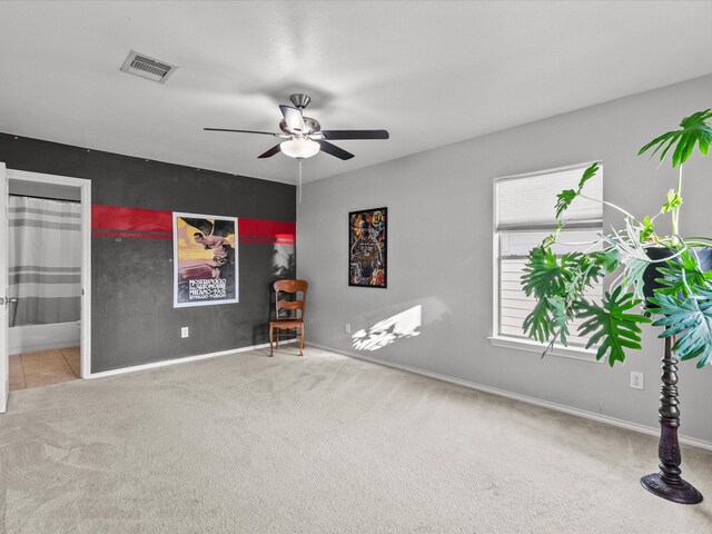 empty room with carpet and ceiling fan