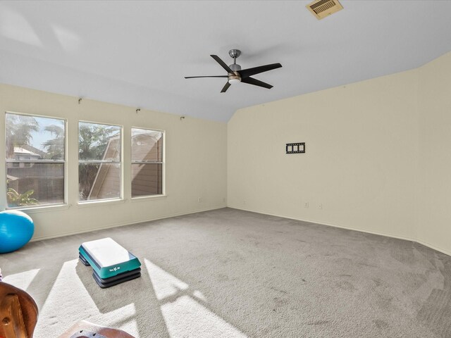 interior space with light carpet and ceiling fan