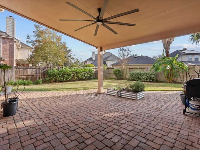 view of patio featuring ceiling fan