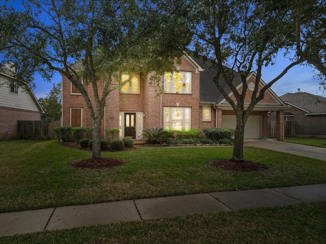 view of front facade featuring a lawn and a garage