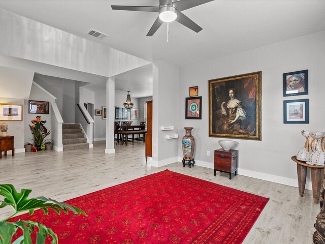 sitting room featuring ceiling fan and light hardwood / wood-style flooring