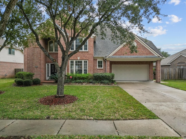 view of front facade featuring a garage and a front lawn