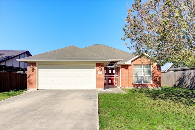 ranch-style house featuring a front yard and a garage