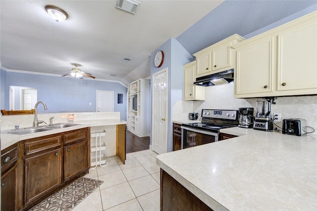 kitchen featuring cream cabinets, sink, crown molding, and stainless steel range with electric stovetop