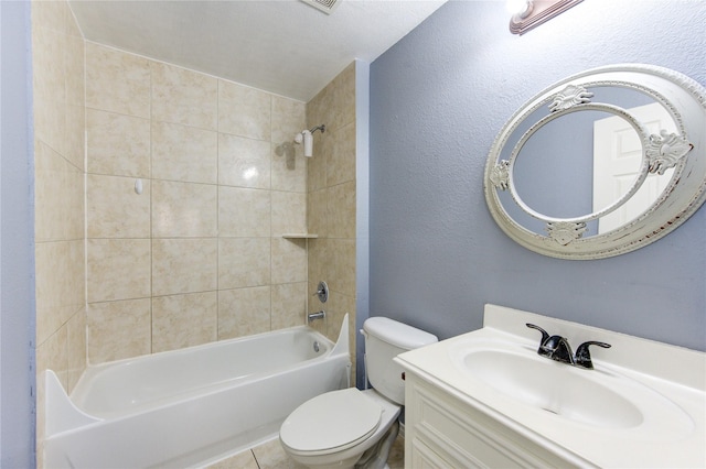 full bathroom with vanity, tiled shower / bath combo, and toilet