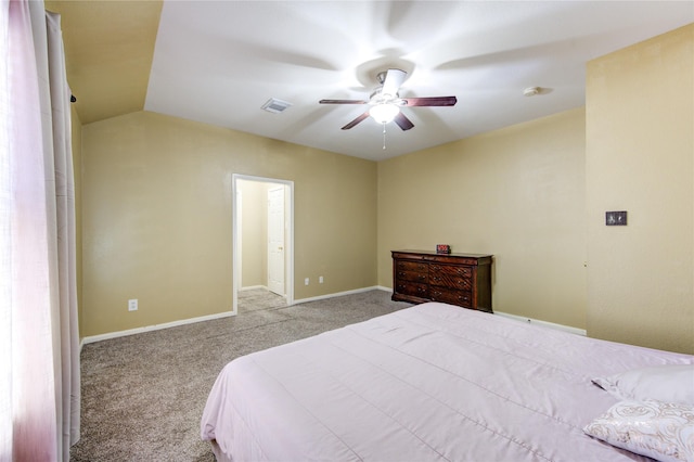 carpeted bedroom featuring ceiling fan and vaulted ceiling