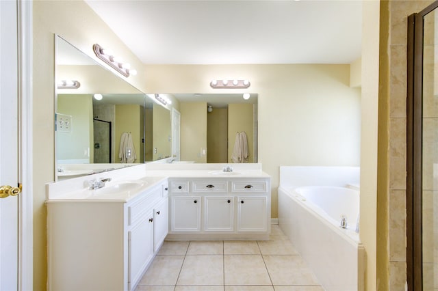 bathroom with tile patterned floors, vanity, and separate shower and tub