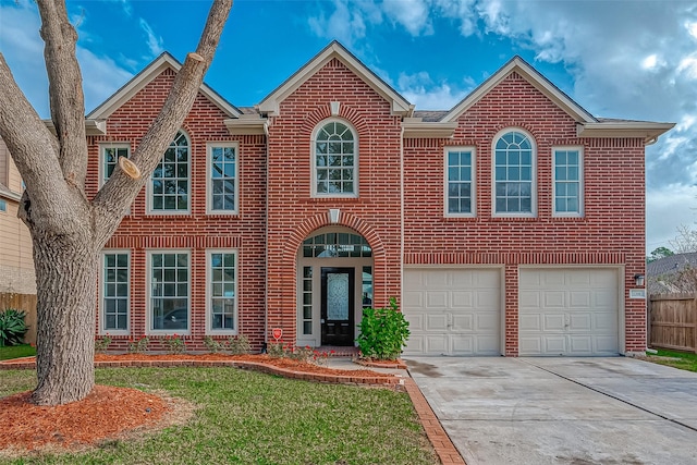 view of front of home featuring a garage and a front lawn