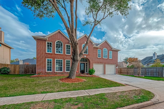 view of front facade featuring a garage and a front lawn