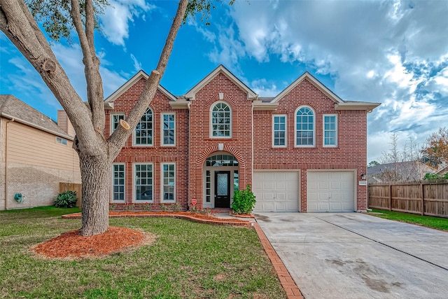 view of front of house featuring a garage and a front yard