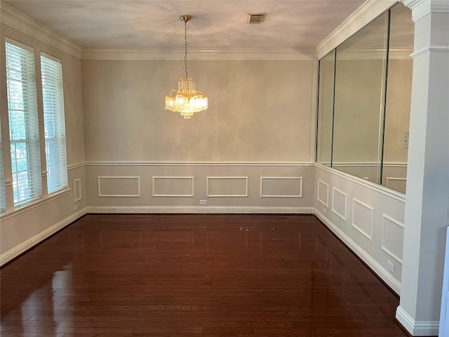 unfurnished dining area featuring a notable chandelier, ornamental molding, and dark wood-type flooring