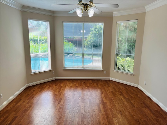 empty room with ceiling fan, wood-type flooring, and ornamental molding