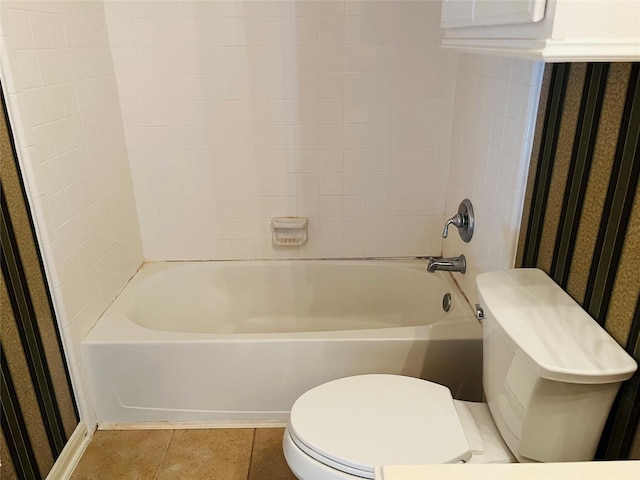 bathroom with tile patterned flooring and toilet