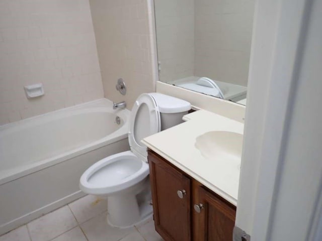 full bathroom with tile patterned floors, vanity, toilet, and tiled shower / bath combo