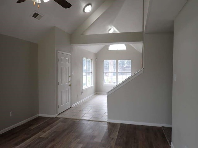 entryway featuring lofted ceiling, hardwood / wood-style flooring, and ceiling fan