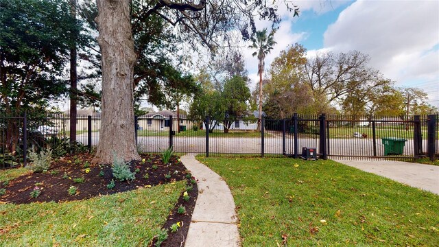 view of property's community with a lawn