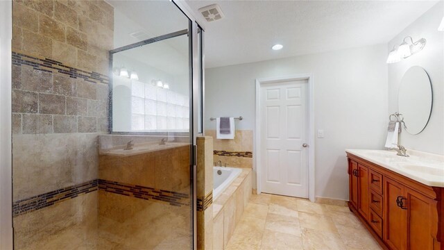 bathroom with vanity, tile walls, and plus walk in shower