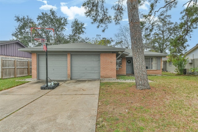 ranch-style house featuring cooling unit, a garage, and a front lawn