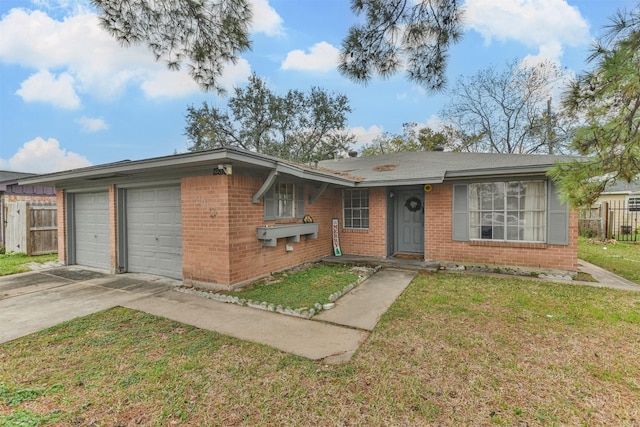 single story home with a garage and a front yard