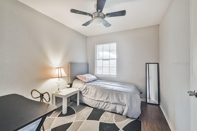 bedroom with ceiling fan and dark hardwood / wood-style flooring