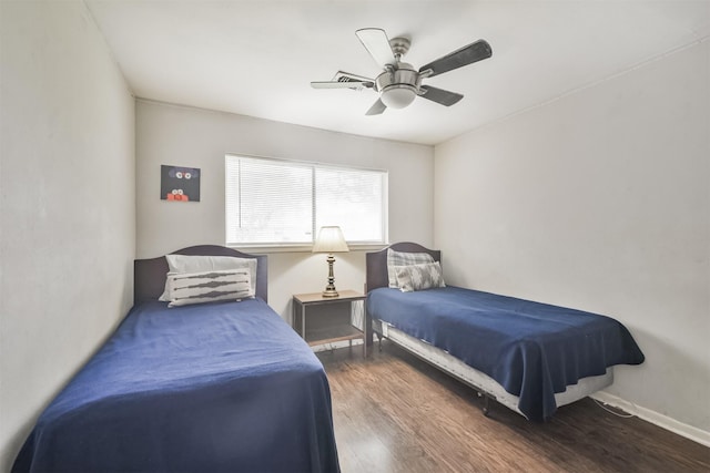 bedroom featuring ceiling fan and dark hardwood / wood-style flooring