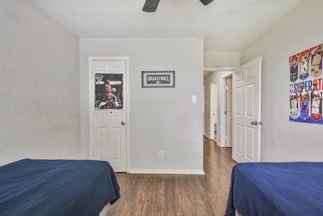 bedroom featuring ceiling fan and dark wood-type flooring