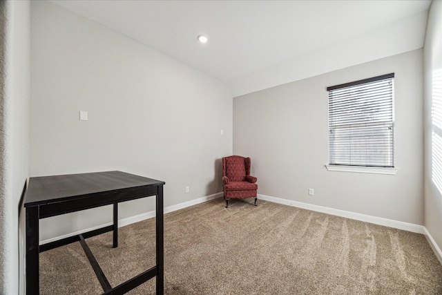 living area with lofted ceiling and carpet floors