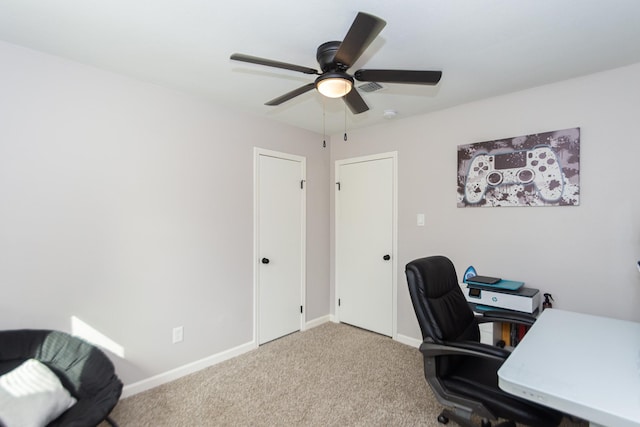 carpeted office featuring ceiling fan