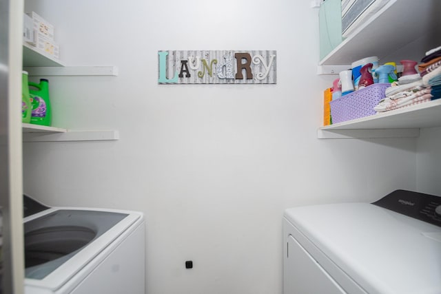 laundry room with washing machine and dryer