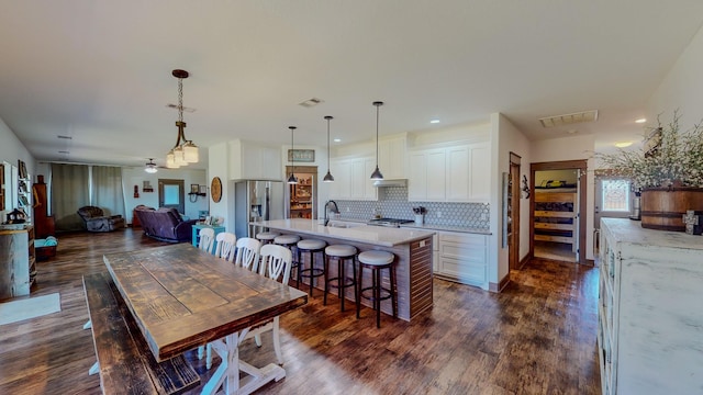 dining room featuring dark hardwood / wood-style flooring and sink